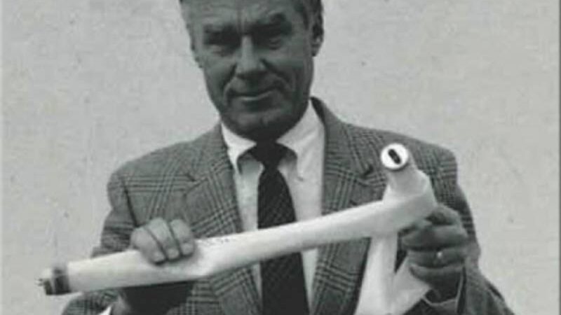 Jim Nolan, founder of Shat-R-Shield, demonstrating a shatterproof lamp