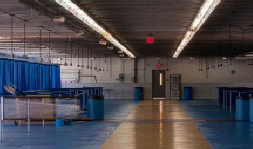 An interior photo of Charlotte Motor Speedway before installation of shatterproof lamps